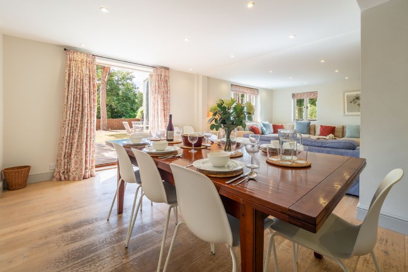 Spacious Dining Area with Wooden Table and Garden Views