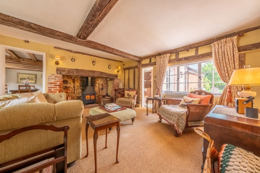 Cosy Living Room with Wood Burning Stove and Exposed Beams