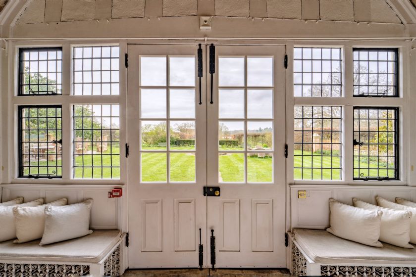 French doors with window seats overlooking garden