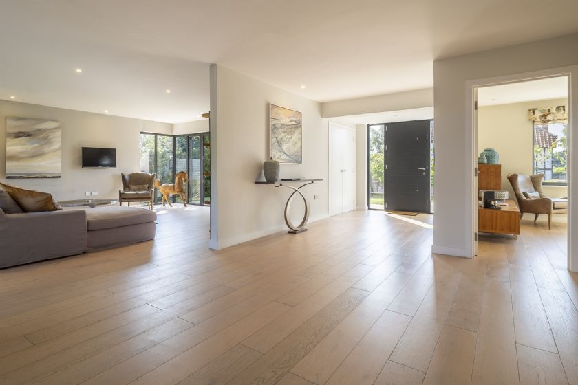 Contemporary open-plan entrance hall with wooden flooring