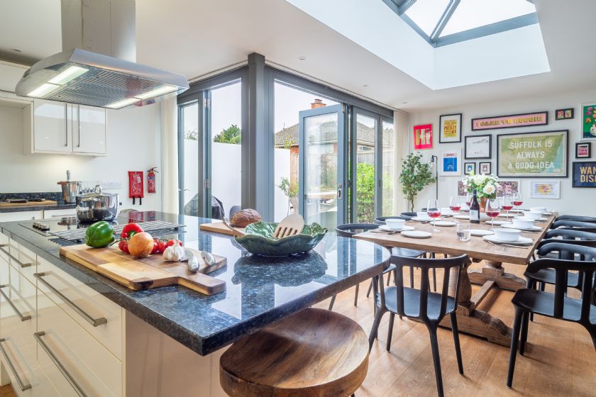 Modern kitchen and dining area with skylight