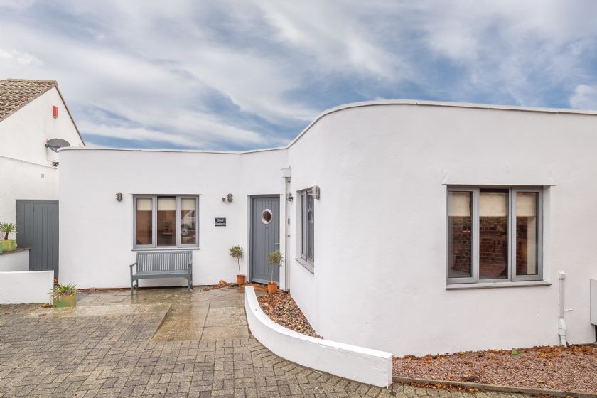 Exterior view of white modern bungalow