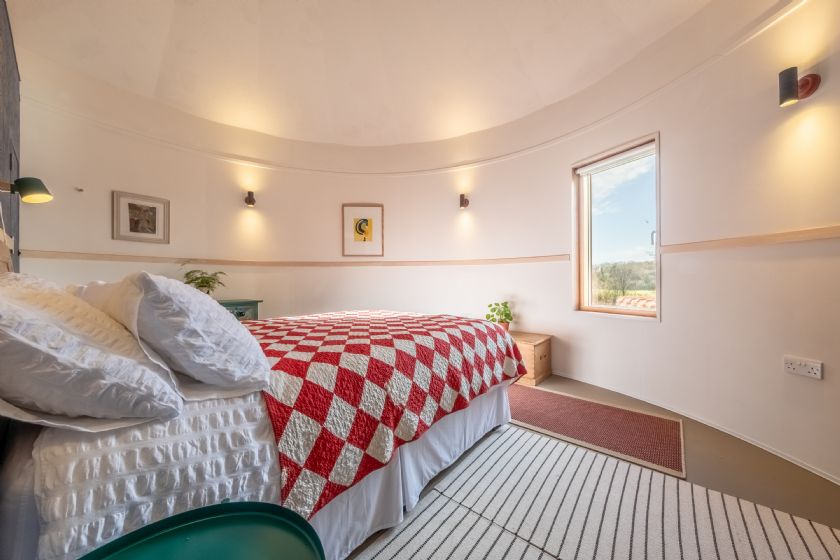 Another bedroom view with checkered quilt