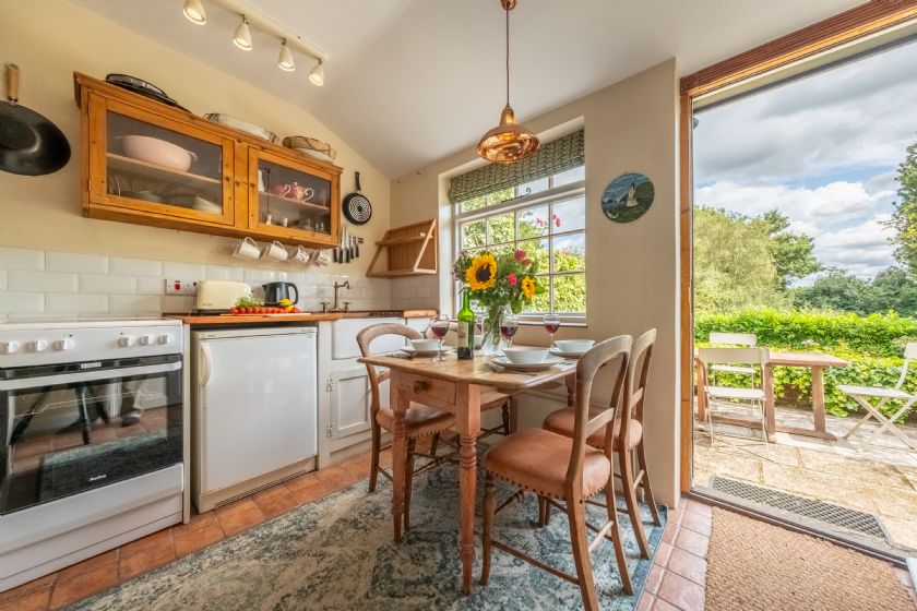 Charming kitchen and dining area in Weaver's Cottage