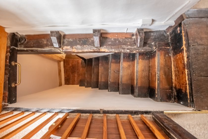 Historic wooden staircase with original timber
