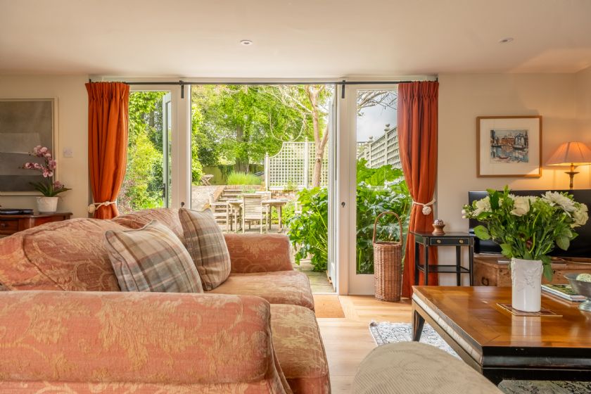 Cosy living room with sliding doors to garden patio